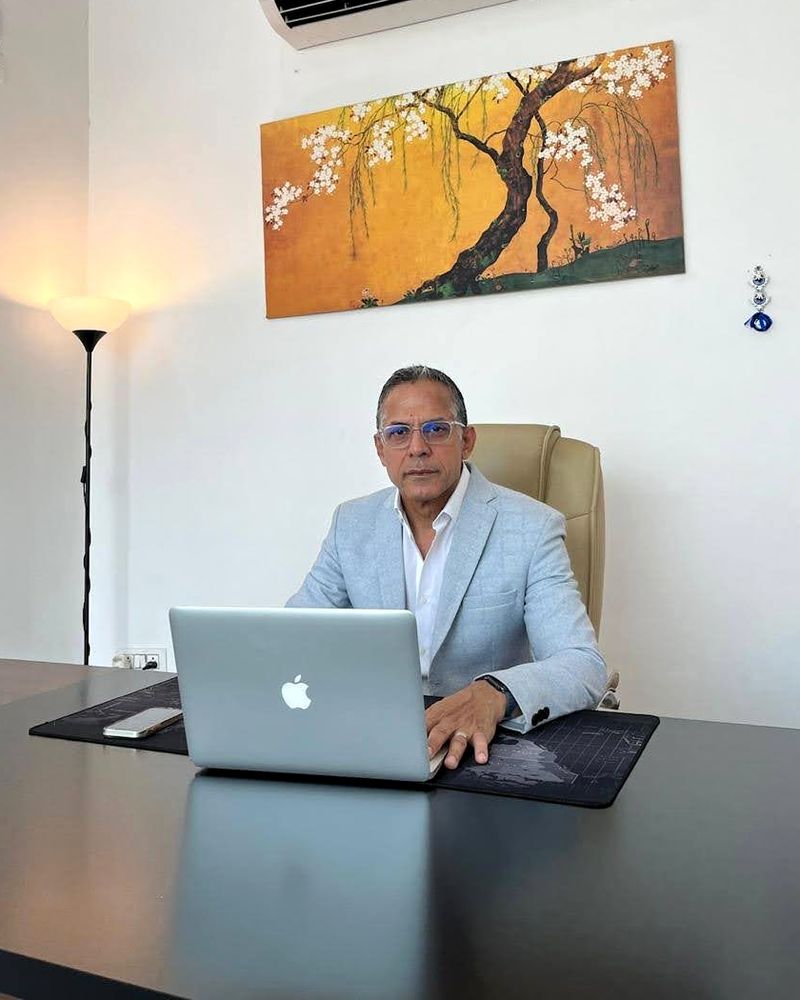 Mukesh Nagpal at his desk in the Interlink Properties office